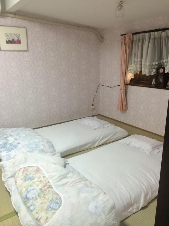 Cama Individual en habitación compartida femenina